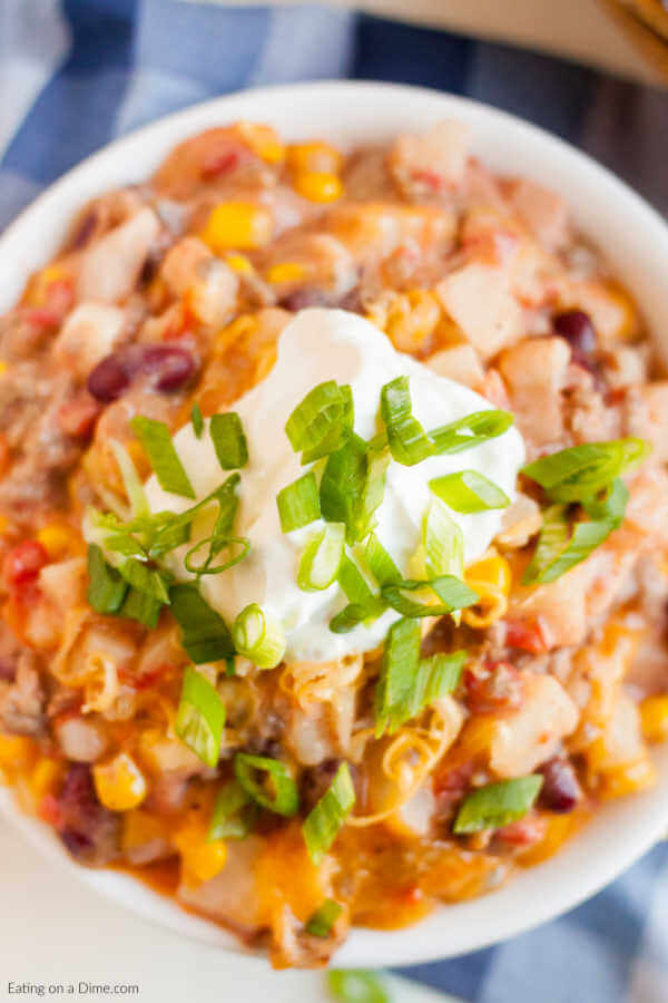 Crockpot Cowboy Casserole Recipe has everything you need for a tasty meal. Packed with flavorful ground beef, hearty beans, cheese and more! 