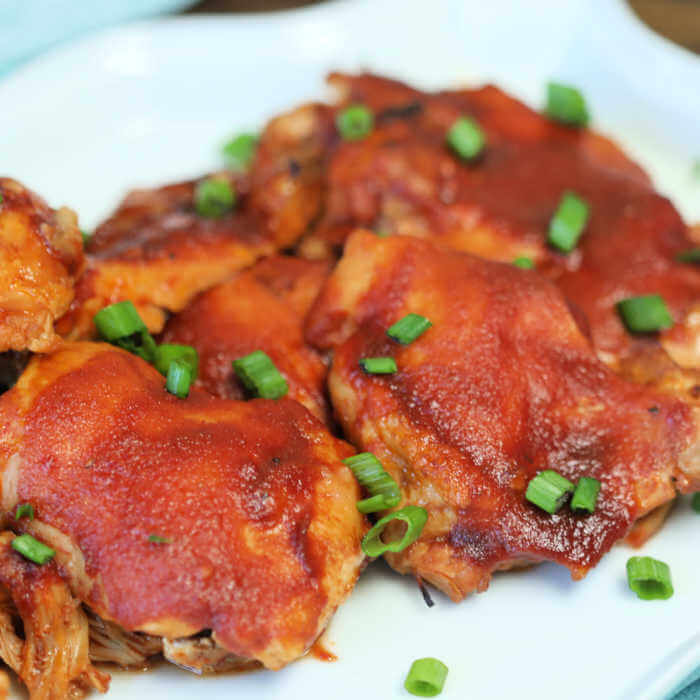 Crock Pot Sticky Chicken has a delicious brown sugar and tomato sauce glaze that will have you scraping the bowl clean. This sticky chicken is the best!