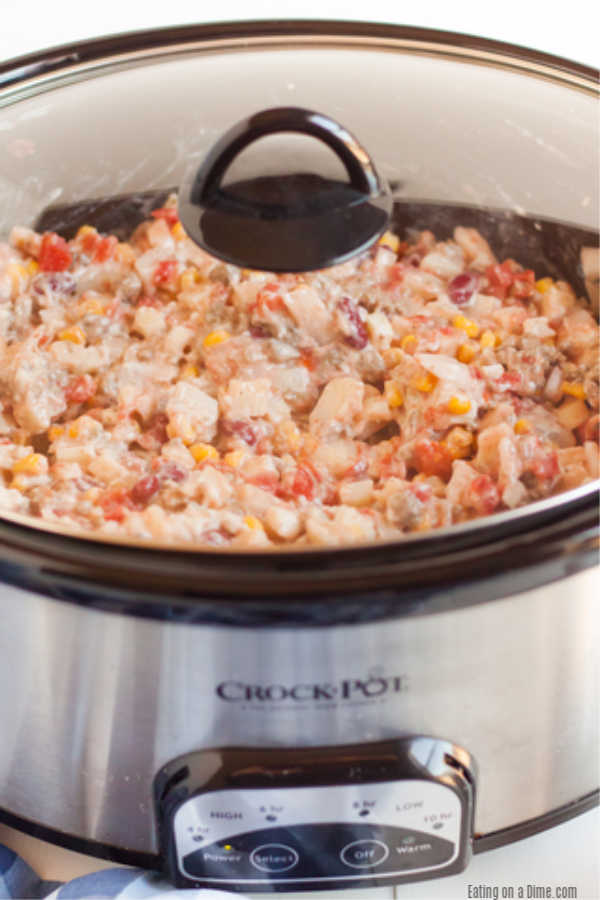 Crockpot Cowboy Casserole Recipe has everything you need for a tasty meal. Packed with flavorful ground beef, hearty beans, cheese and more! 
