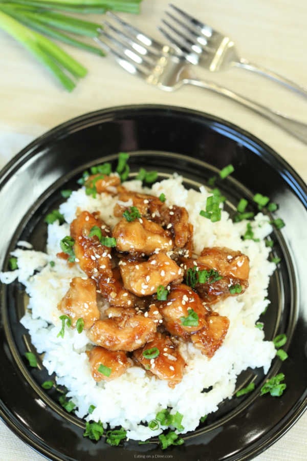 Enjoy delicious Crockpot orange chicken from the comfort of your home and save time and money.  The savory and sweet orange sauce is thick and delicious.