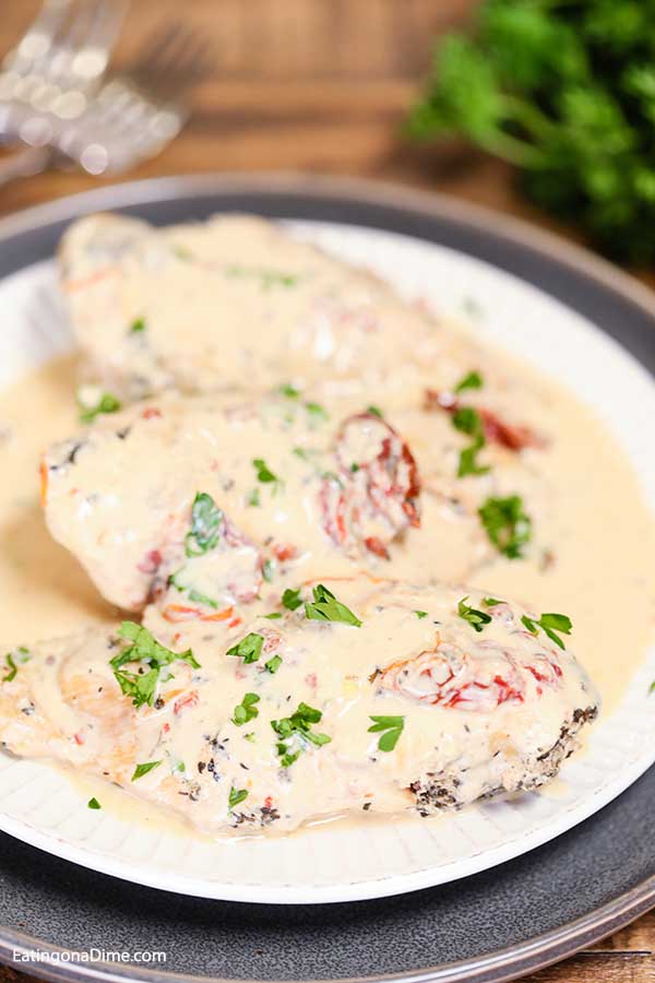 Slow Cooker Creamy Sun Dried Tomato Chicken Recipe is a big hit. The creamy sun dried tomato sauce is rich and decadent and we love it over pasta.