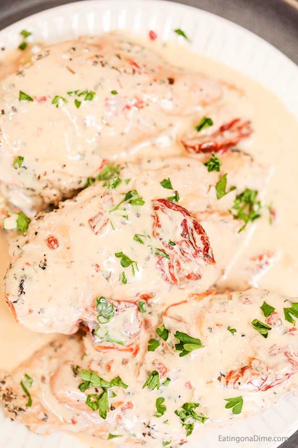 Slow Cooker Creamy Sun Dried Tomato Chicken Recipe is a big hit. The creamy sun dried tomato sauce is rich and decadent and we love it over pasta.