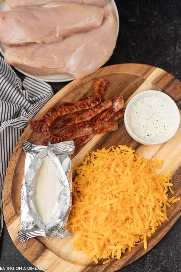 picture of ingredients - chicken, bacon, ranch, cream cheee, shredded cheese.