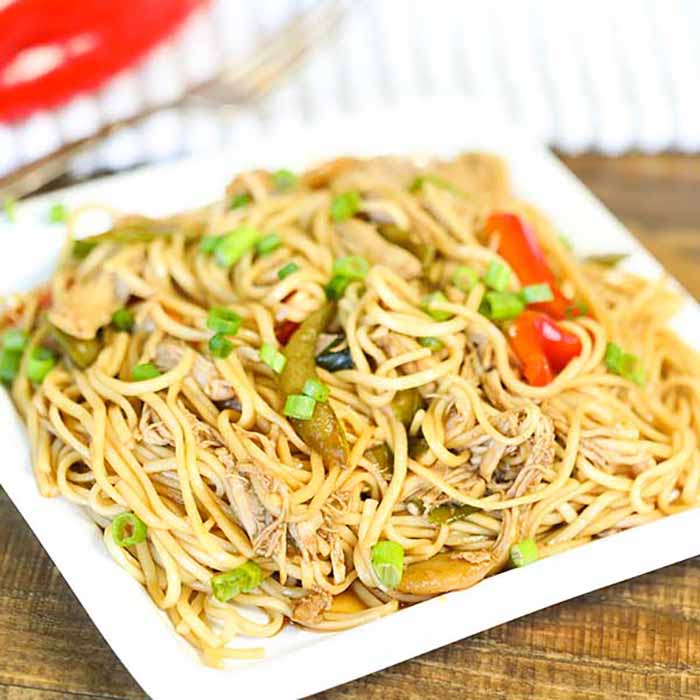 No need to order take out when you can make this easy and delicious Crock pot Chicken Lo Mein Recipe at home. The slow cooker does all the work.