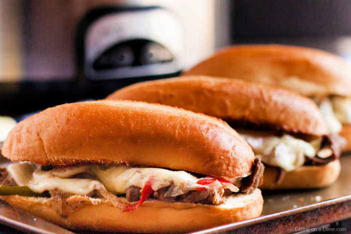 Close up image of philly cheesesteak on a baking sheet. 