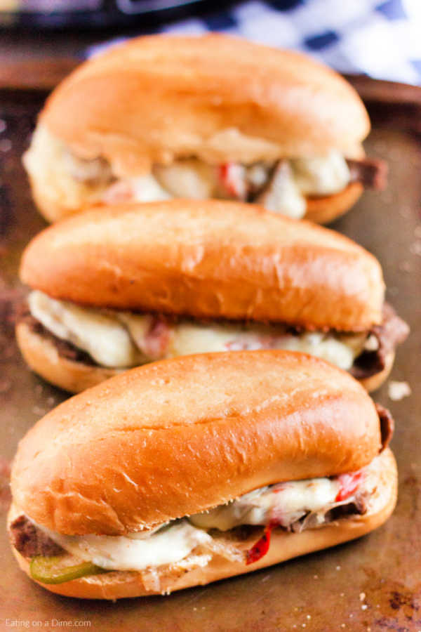Close up image of philly cheesesteak on a baking sheet. 
