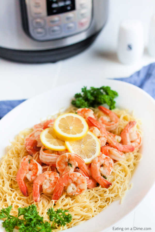 Instant pot shrimp scampi recipe comes together in only 2 minutes thanks to the pressure cooker! Enjoy delicious shrimp scampi in hardly any time at all!