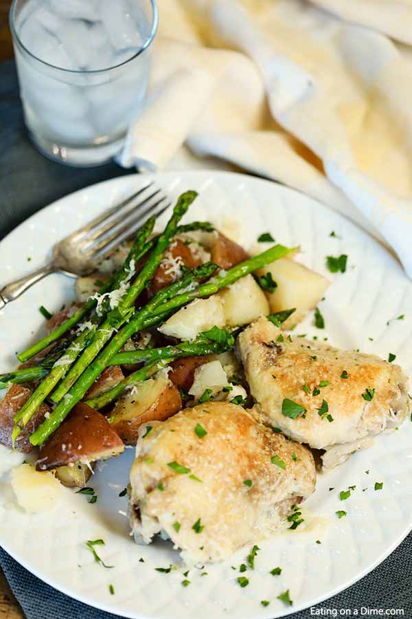 Make Slow Cooker Garlic Parmesan Chicken Thighs Dinner for a meal your family will love. Flavorful chicken thighs, potatoes and more make a delicious meal.