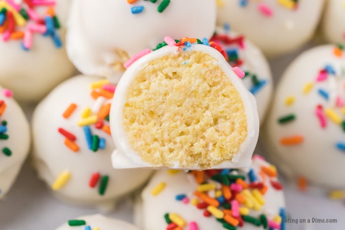 If you need a simple yet tasty dessert, try Easy Cake Ball Recipe. It is the perfect dessert for parties, holidays and more but easy enough to make anytime! Cake balls with sprinkles close up photo