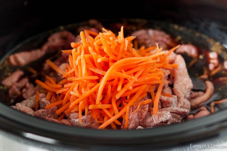 Close up image of Mongolian Beef in process in a crock pot. 