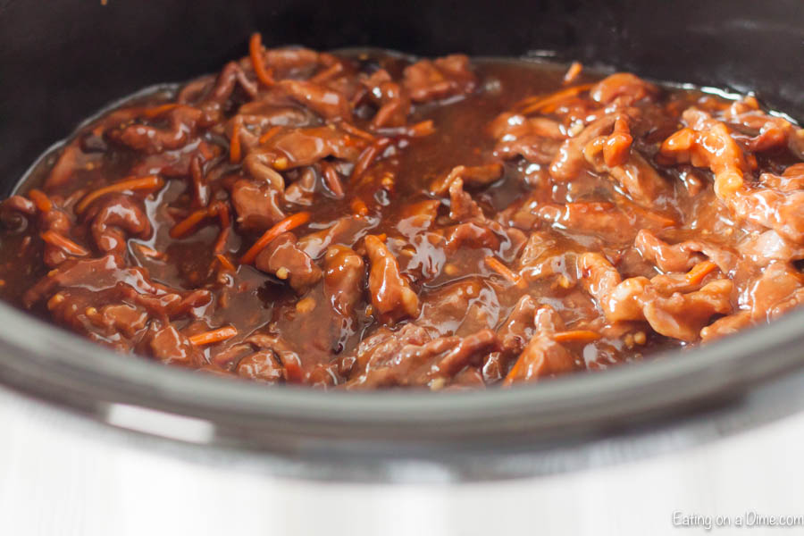 Close up image of Mongolian Beef in a crock pot. 