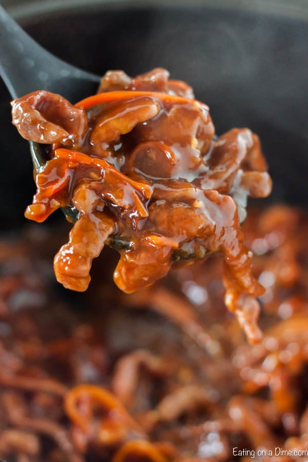 Close up image of  Mongolian Beef on a fork. 