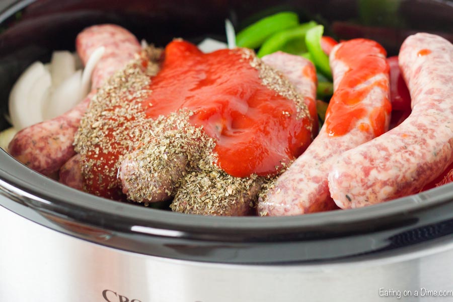 Uncooked sausage and peppers in the crock pot