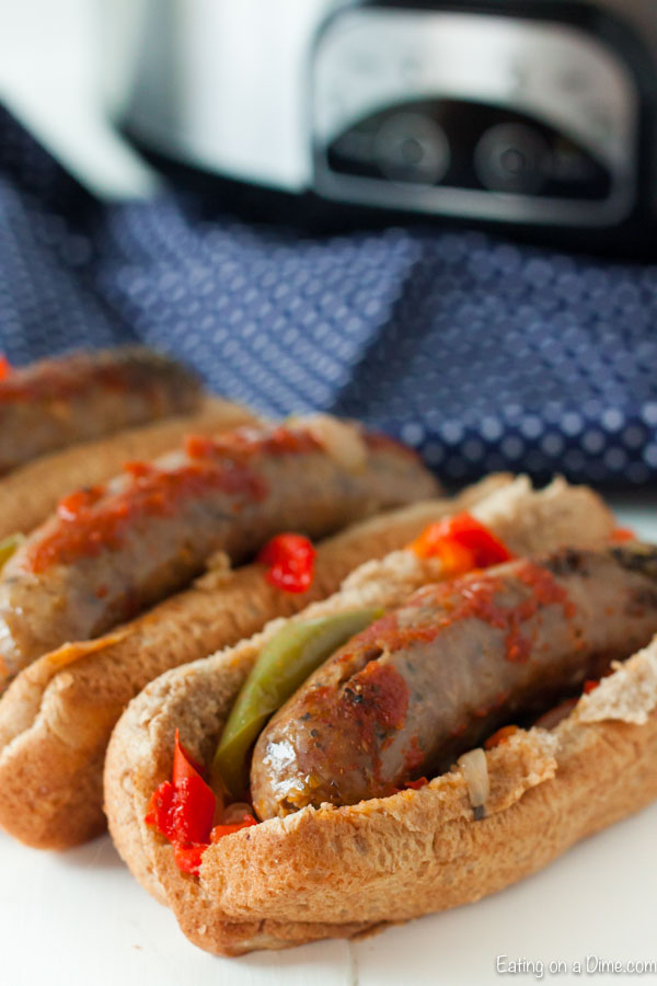 Close up image of italian sausage and peppers in a hoagie
