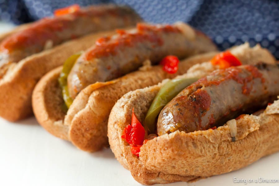 Close up image of italian sausage and peppers in a hoagie