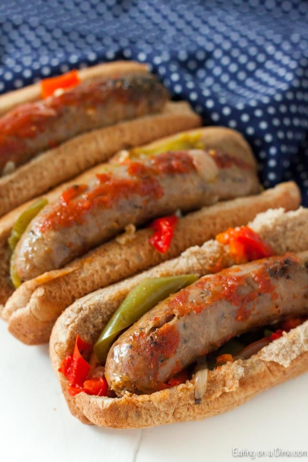 Close up image of italian sausage and peppers in a hoagie