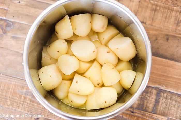 Close up image of chopped potatoes in the instant pot. 