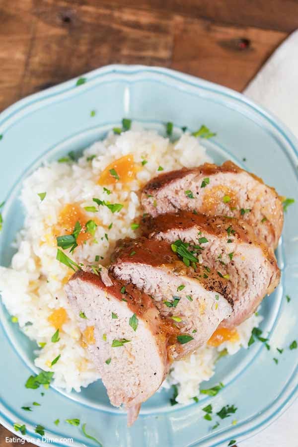 Crock pot pork tenderloin with peaches is the easiest crock pot recipe and so delicious. The pork is so tender and the peach glaze is sweet and savory.