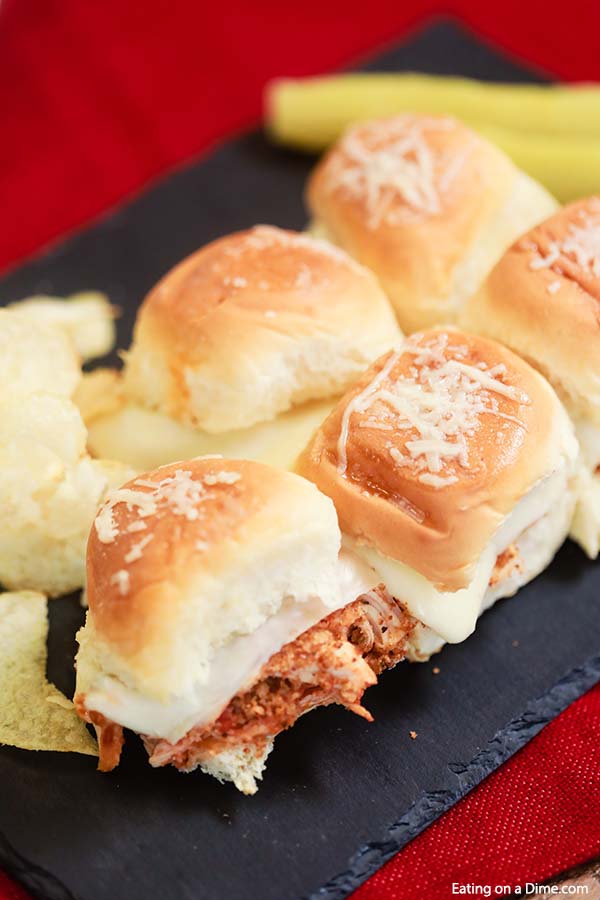 Crock Pot Chicken Parmesan Sliders are so fun to make and eat. They are perfect for family dinner, Game day, parties and more! The chicken is amazing. 