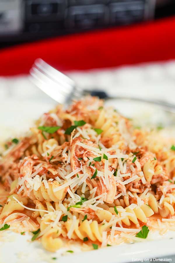 Enjoy Chicken Parmesan Pasta Bake any day of the week thanks to this amazing Crock Pot Chicken Parmesan Pasta Recipe. This is the best one pot meal. 