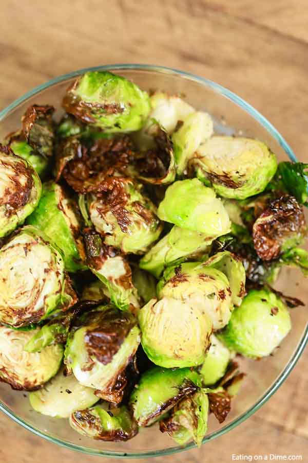 Close up of Air Fryer Roasted Brussel Spouts in a glass bowl