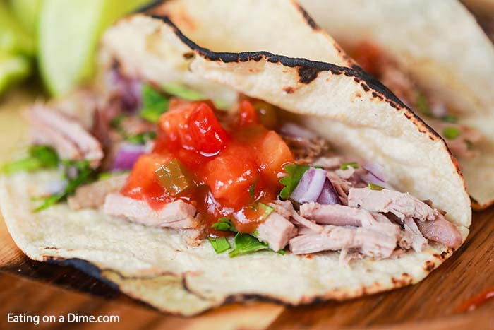 Tender pork and peach salsa come together for the best Crock Pot Pork Tenderloin Tacos. Enjoy this meal any night of the week thanks to the crock pot.