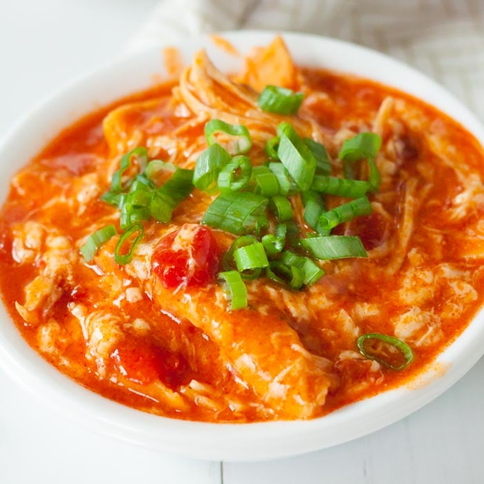 Buffalo chicken enchilada casserole in a white bowl