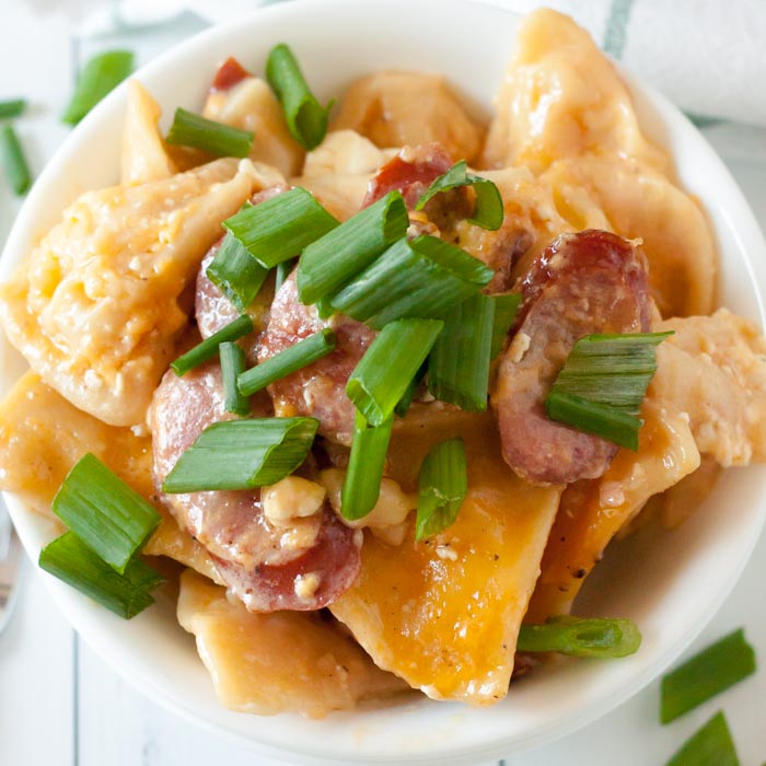 Crock Pot Cheesy Pierogi and Kielbasa Casserole is an easy one pot meal for the best comfort food. Dinner is a breeze with this flavor packed recipe.