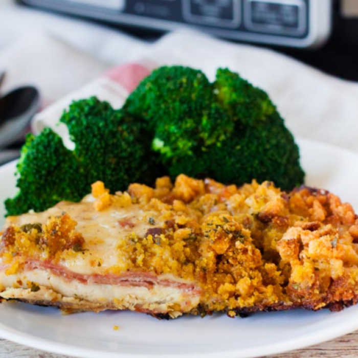 Chicken Cordon Bleu on a plate with a side of broccoli