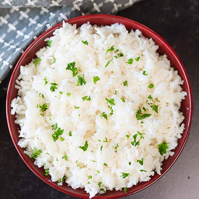 Close up image of a bowl of white rice. 