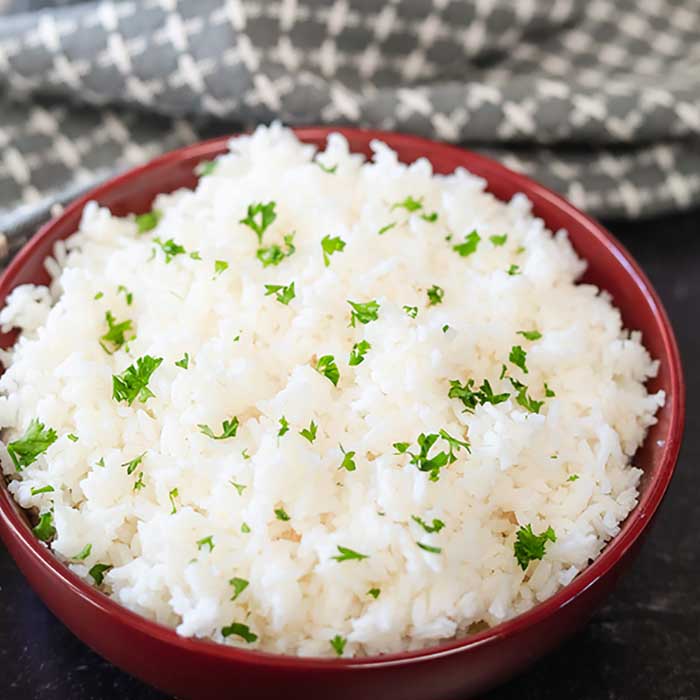 Close up image of a bowl of white rice. 