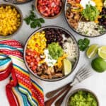 Mexican rice bowl with chicken, corn, beans, and rice.