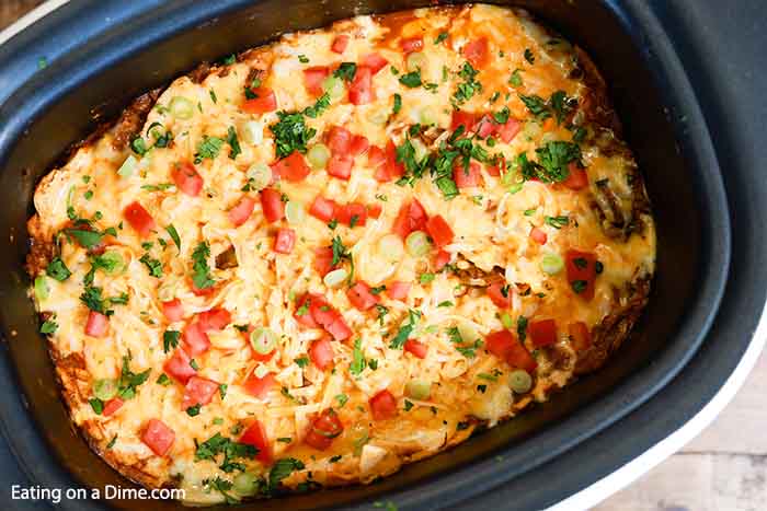 Crock Pot Shredded Beef Enchilada Casserole has all the flavors of enchiladas in an easy to make casserole.It is the perfect meal to make during busy weeks.