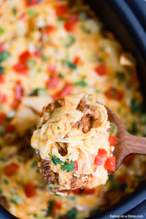 Crock Pot Ground Beef Enchilada  serving on a wooden spoon
