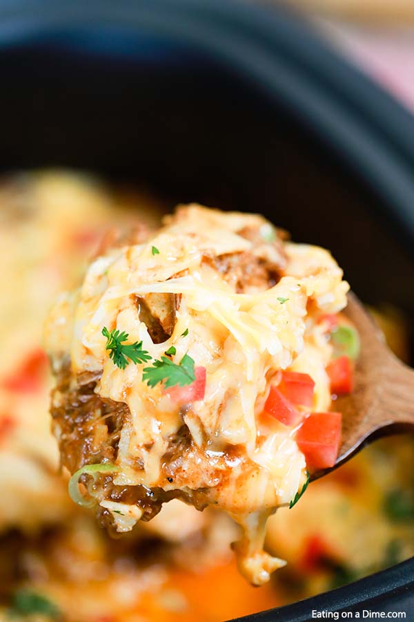 Crock Pot Ground Beef Enchilada  serving on a wooden spoon