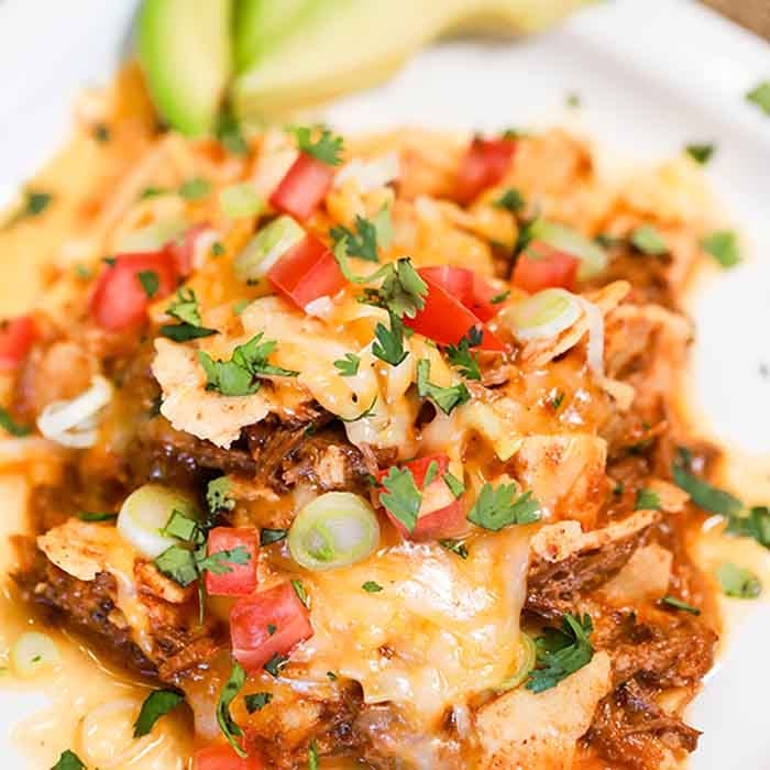 Crock Pot Shredded Beef Enchilada Casserole has all the flavors of enchiladas in an easy to make casserole.It is the perfect meal to make during busy weeks.