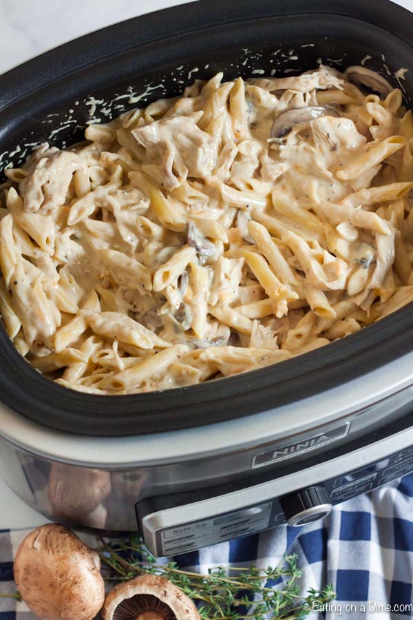 Crock pot cheesy chicken penne recipe is the best comfort food and loaded with tons of creamy chicken and cheesy pasta.  The slow cooker does all the work!
