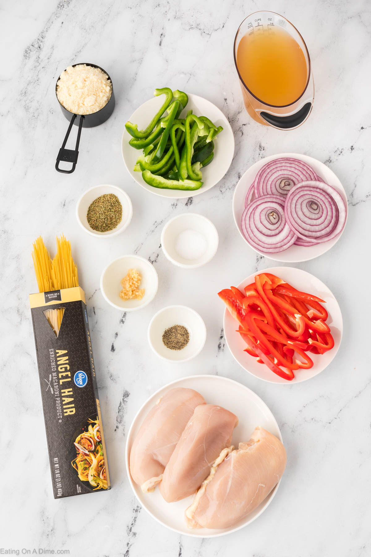 Chicken Scampi Ingredients - chicken breast, red onion, red bell pepper, green bell pepper, chicken broth, Italian Seasoning, Minced Garlic, salt and pepper, pasta, parmesan cheese
