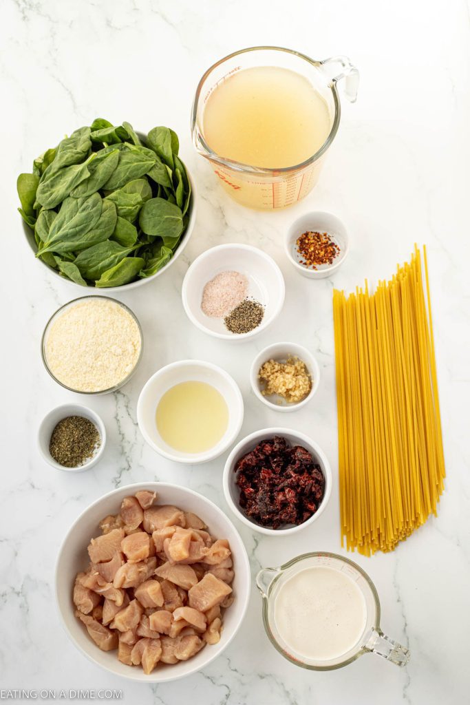 Ingredients needed - chicken breast, olive oil, salt and pepper, sun dried tomatoes, garlic, linguine, italian seasoning, red pepper flakes, chicken broth, spinach, heavy whipping cream, parmesan cheese