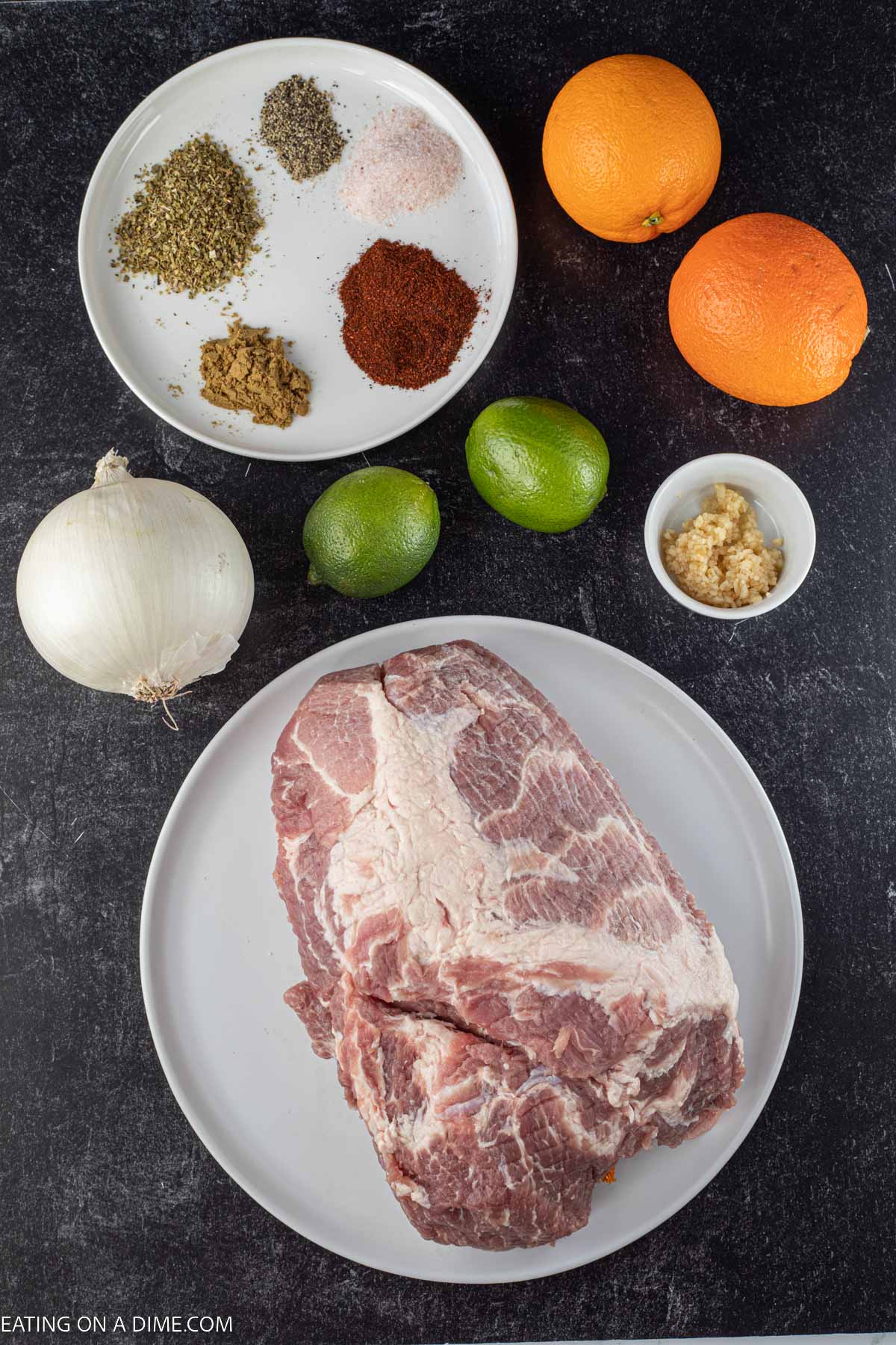 Ingredients needed - pork shoulder, onion, garlic, oregano, chili powder, cumin, pepper, salt, limes, orange juice