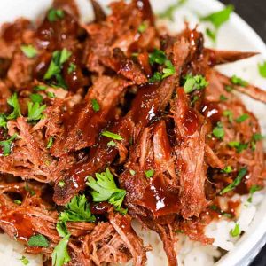 Tender beef is slow cooked to perfection in adobo sauce and BBQ sauce for the best Crock pot chipotle bbq beef recipe. It is so easy and delicious.