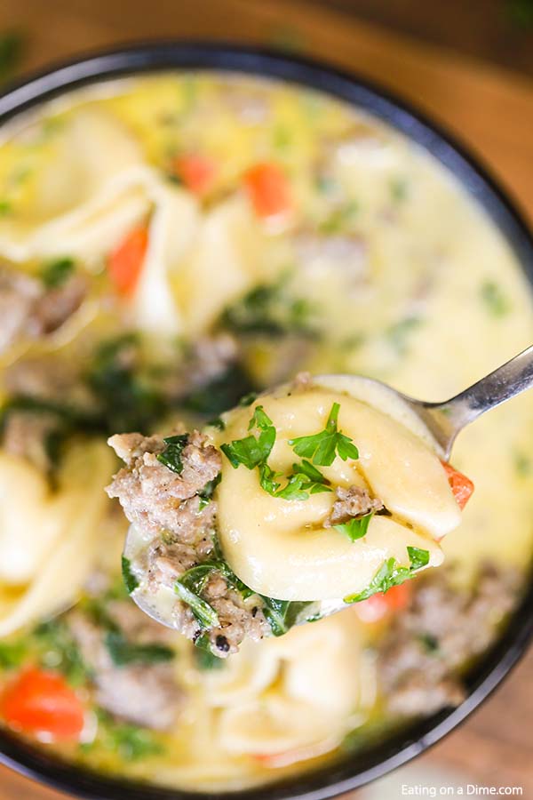 Crock Pot Italian sausage tortellini soup recipe is an easy and delicious one pot meal. Each bite is creamy and delicious for the best comfort food.
