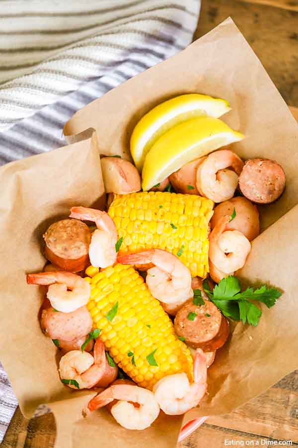 Shrimp, corn and more come together for a meal everyone will love in this Crock Pot Shrimp Boil Recipe. This slow cooker shrimp boil is a must try!