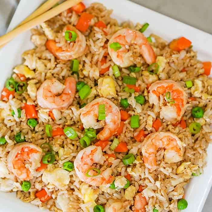Skip takeout and make this delicious Shrimp Fried Rice Recipe at home in minutes. The shrimp and veggies have the best flavor to make the perfect meal.