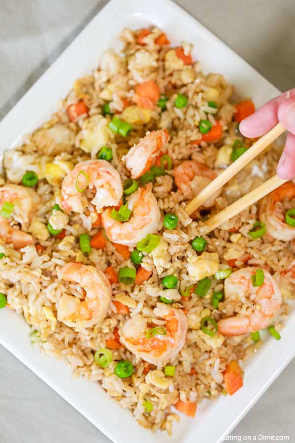 Skip takeout and make this delicious Shrimp Fried Rice Recipe at home in minutes. The shrimp and veggies have the best flavor to make the perfect meal.