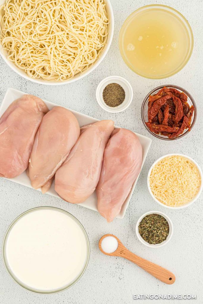 Ingredients needed - chicken breasts, chicken broth, salt and pepper, basil, sun dried tomatoes in olive oil, heavy cream, angel hair pasta, parmesan cheese