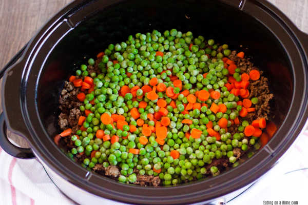 Frozen peas and carrots in a slow cooker