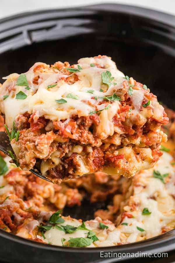 Turkey Lasagna in a crock with a serving on a spatula