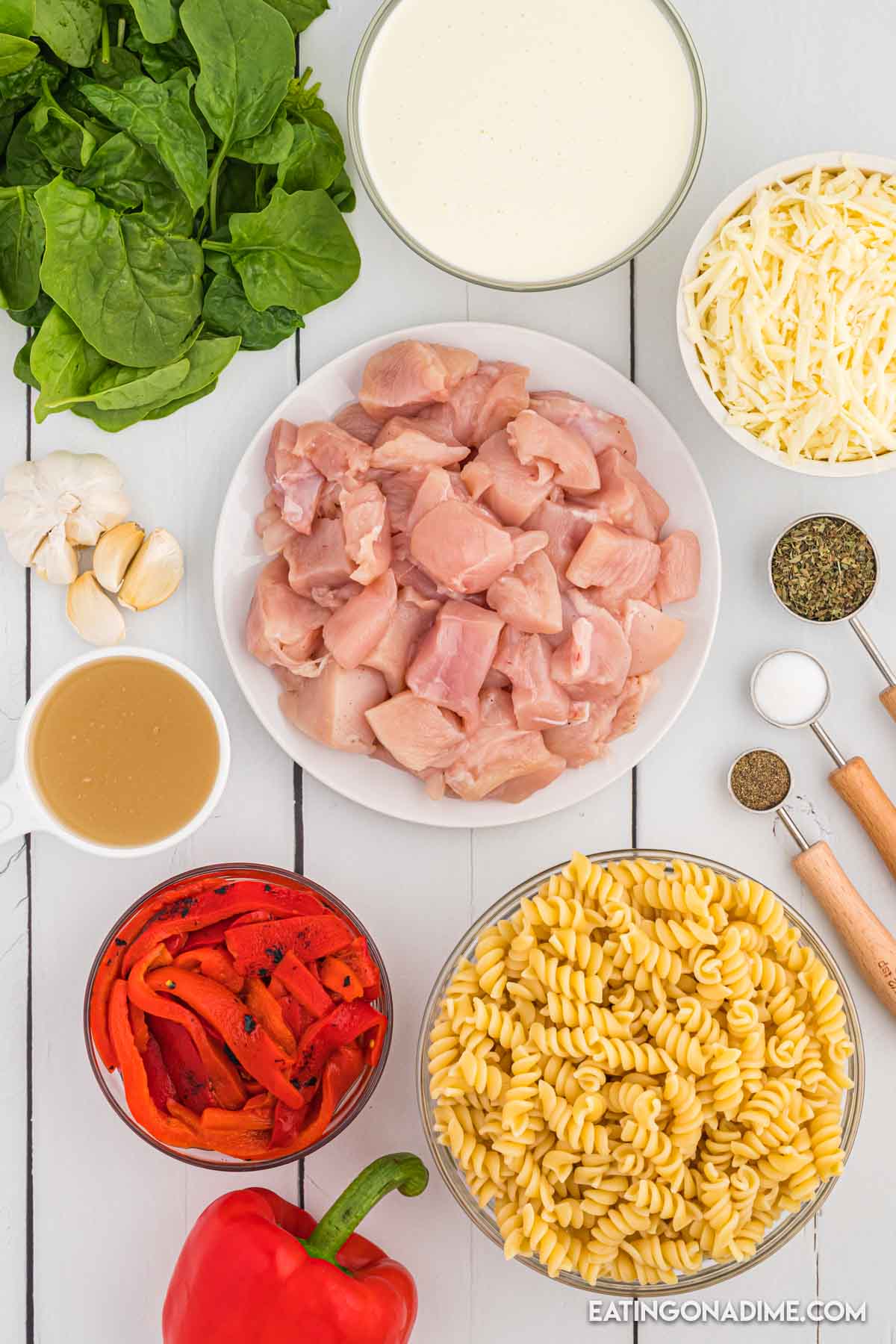 Ingredients needed - chicken, roasted red peppers, minced garlic, dried basil, salt and pepper, chicken broth, fresh spinach, heavy cream, rotini mozzarella cheese