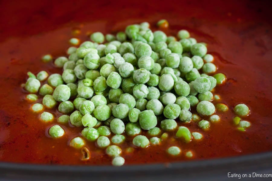 Adding peas to the stew